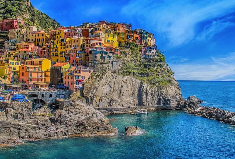 Colorful cliffside village by the ocean.