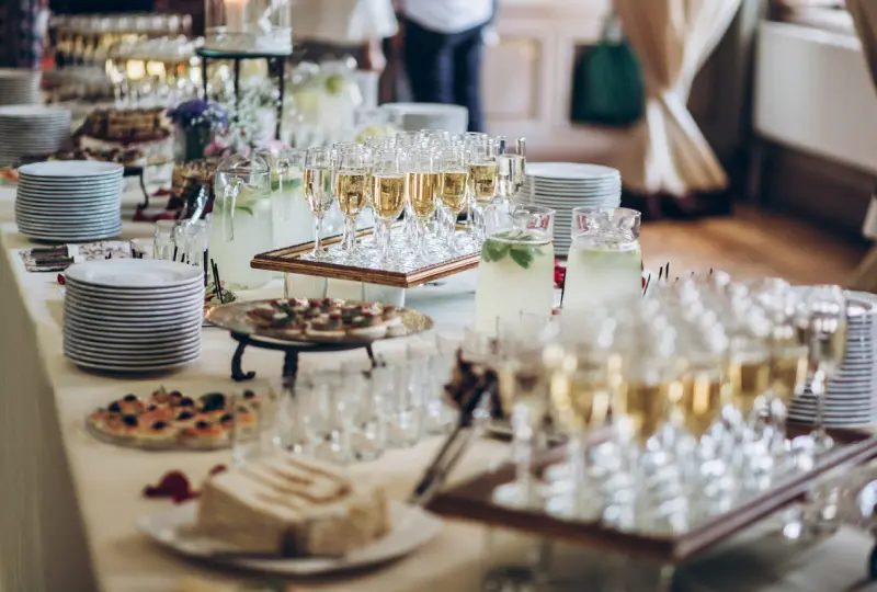 Buffet table with drinks and appetizers.